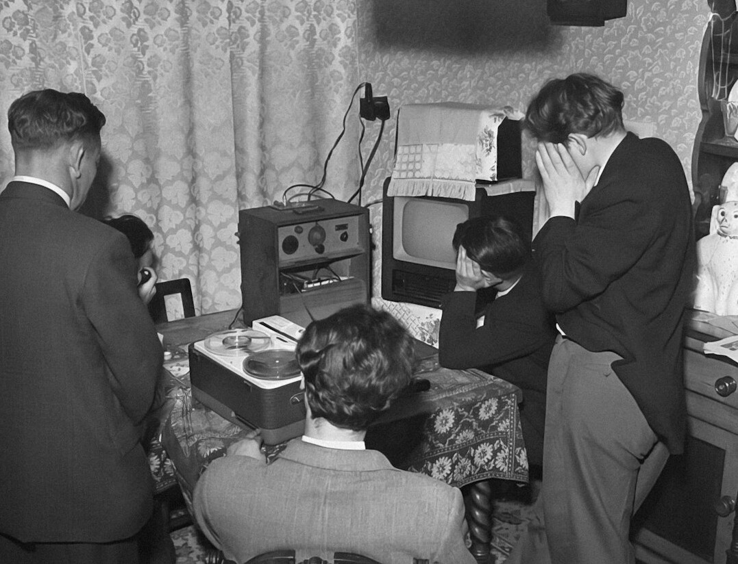 family watching old tv