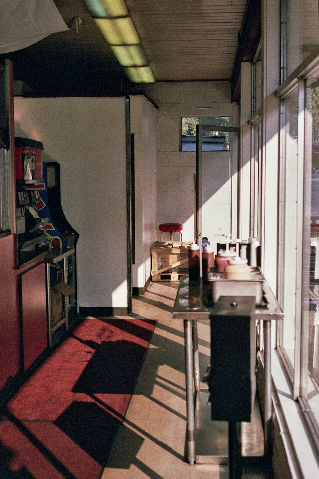 Vintage television control room with rows of monitors and a mixing desk