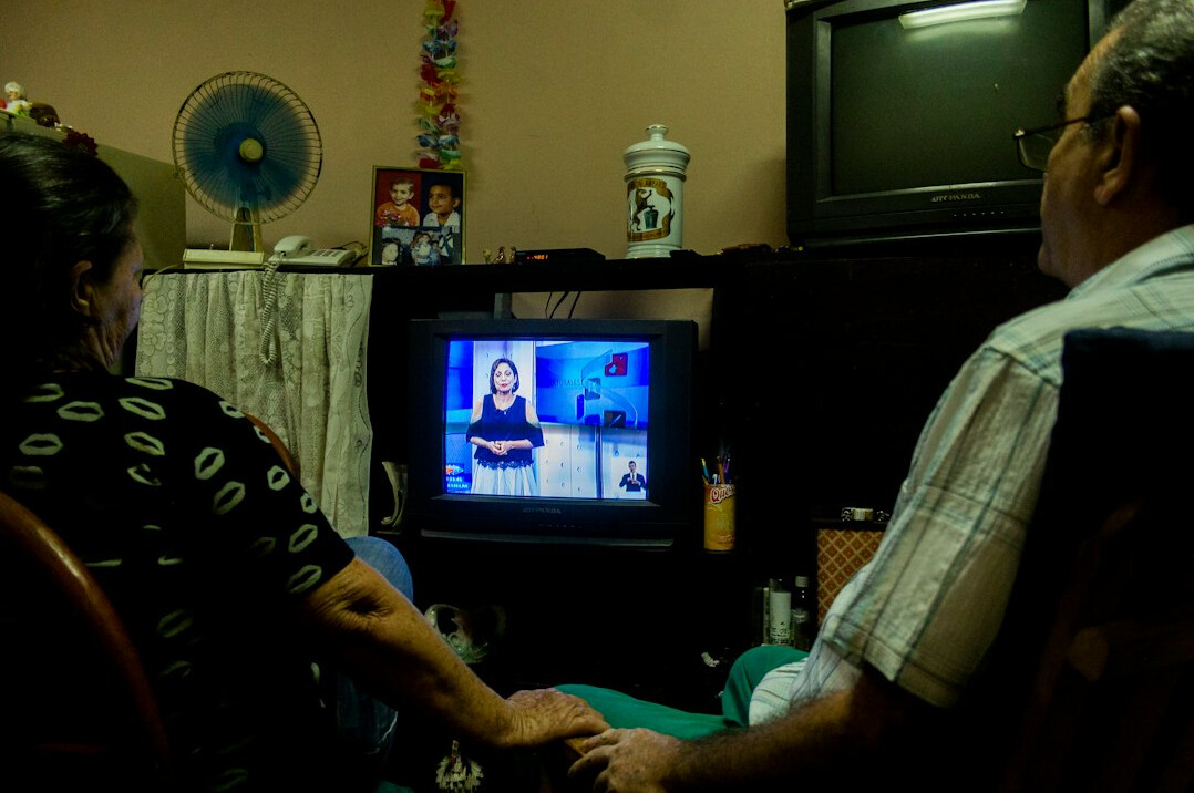 family watching old tv